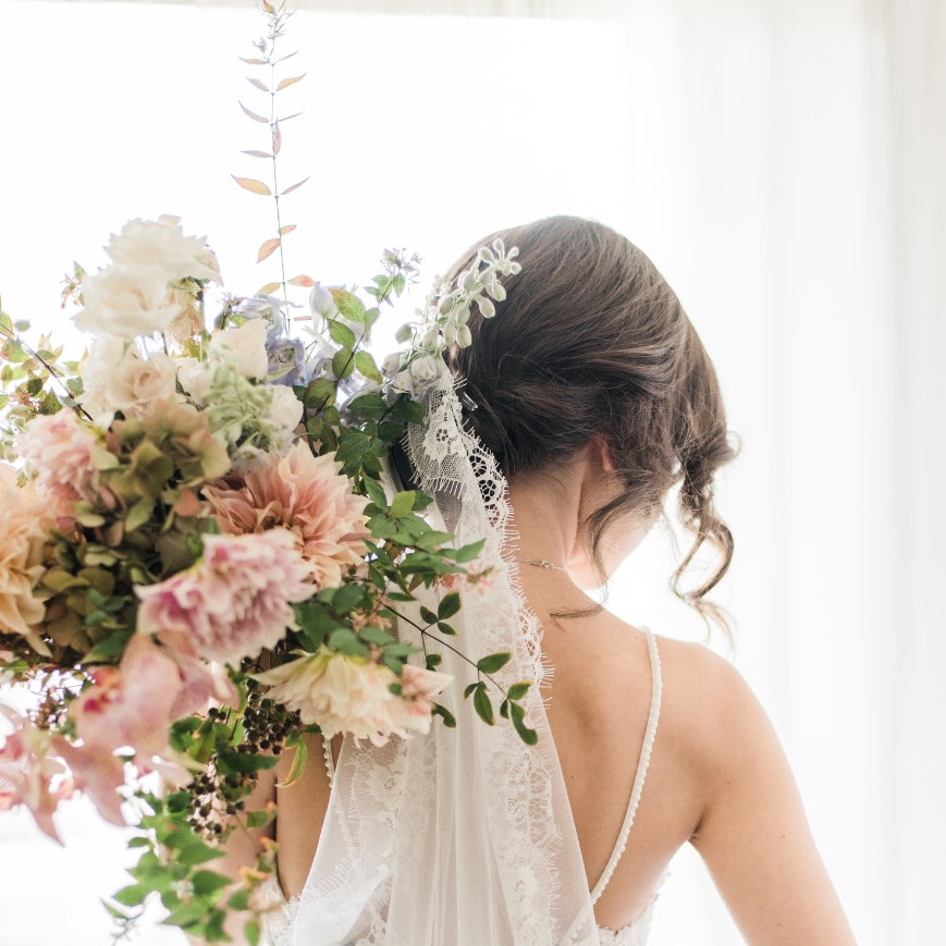 bride with pink flowers