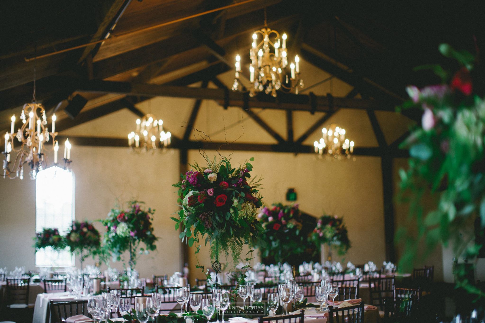 beautiful wedding reception lorals on table settings